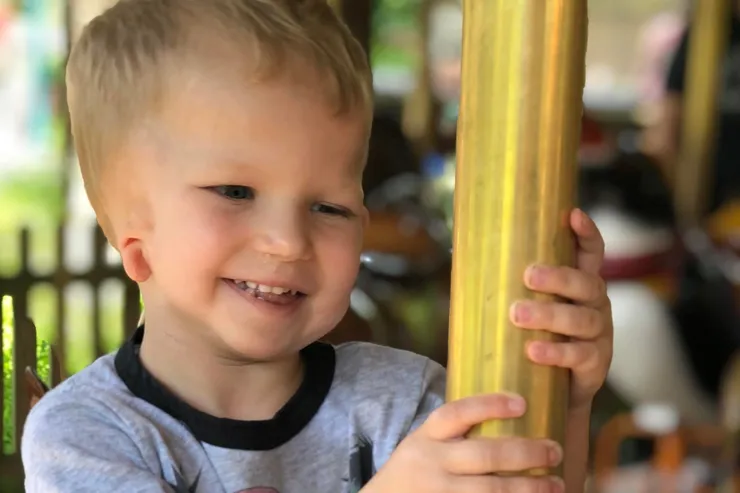 Young blonde boy with hearing loss