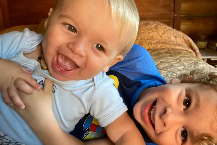 Brothers hugging and laughing