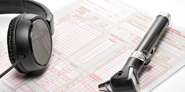 Audiology instruments - headphones and an otoscope